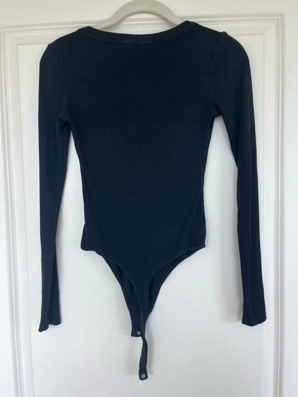 Elodie Black Long-Sleeve Scoop Neck Bodysuit with Snap Hem